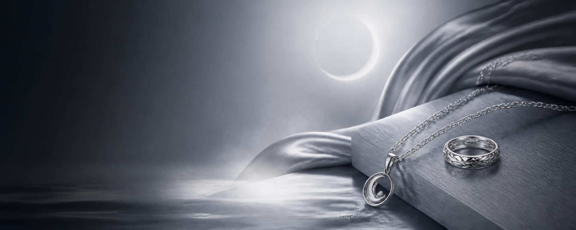 Lunaire 925 sterling silver pendant and ring under moonlight